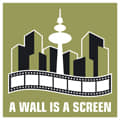 A Wall is a Screen: ALCINE is Walking about the Streets !