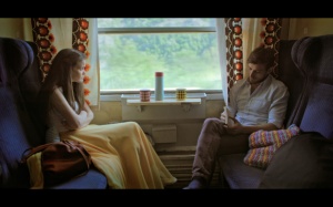 SHE IS WAVING FROM THE TRAIN